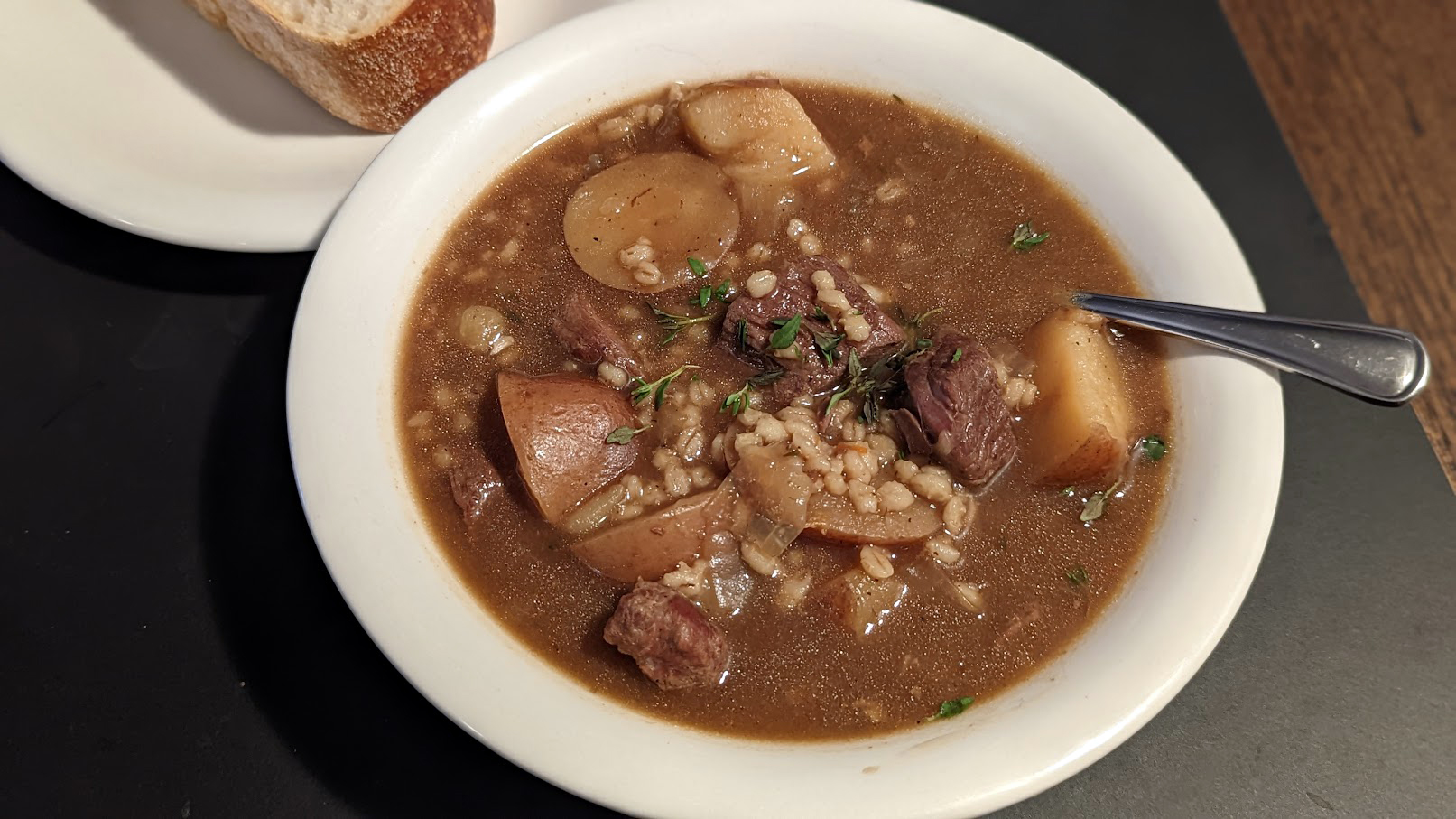 photo of a bowl of lamb stew with barley and potatoes